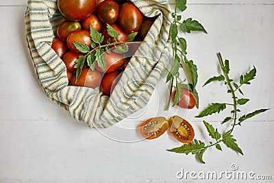 Market delivary of brown tomatoes in eco textile bag, Zero waste Stock Photo