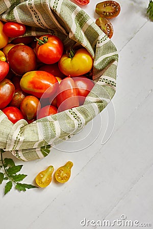 Market delivary of Different kinds of tomatoes in eco textile bag Stock Photo
