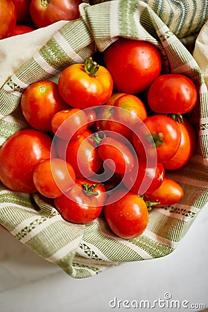 Market delivary of Different kinds of tomatoes in eco textile bag, Zero waste Stock Photo