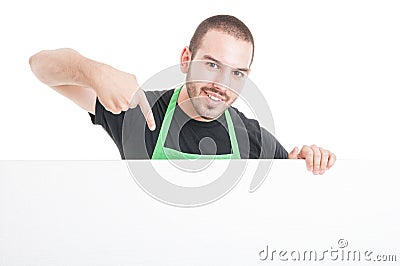 Market employee showing big blank advertising board Stock Photo