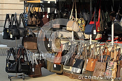 Market for handbags and purses on the street. Imitation of brand bags. Fake branded ladies hand Editorial Stock Photo