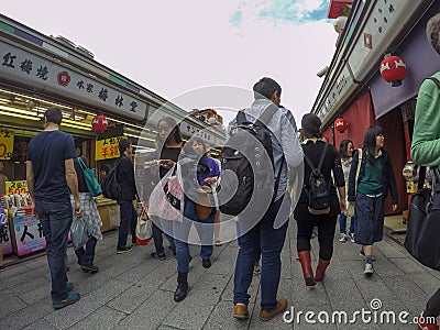 Market in Japan full of different people, west-east, big-small, Editorial Stock Photo