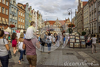 Market in the old part of Gdansk with many happy people on the street, nice summer dayK Editorial Stock Photo