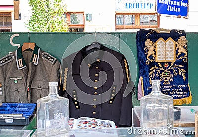 Market stall catering to tourists, selling Judaica and vintage items of Jewish interest, in Plac Nowy, Kazimierz, Krakow Poland Stock Photo