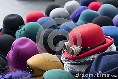 A pile of multicoloured bowler hats on a stall Stock Photo