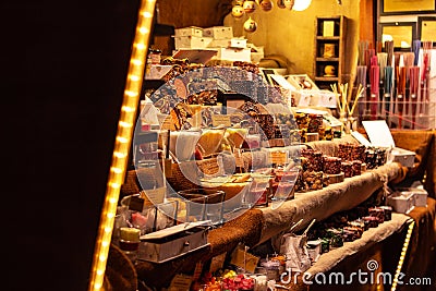 Market stall showing an assortment of handmade candles from spices at traditional famous christmas market at Merano Editorial Stock Photo