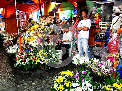 Market vendor selling flowers in quiapo in the philippines Editorial Stock Photo