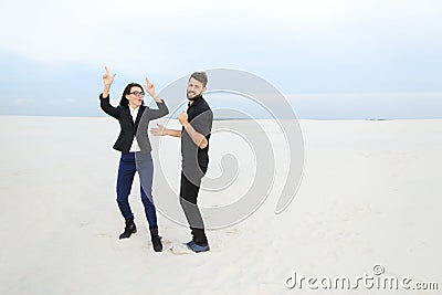 Marketers male and female rejoicing at start of vacation at se Stock Photo