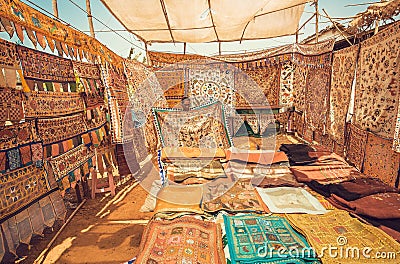 Marketplace with old blankets and carpets with traditional colorful patterns at morning market street Editorial Stock Photo