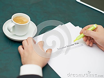 Marking words in a negative income tax definition Stock Photo