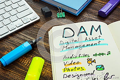 Marks about DAM digital asset management in the note. Stock Photo