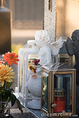 Marmoreal white Angel at the cemetery, sorrow, sunlight Stock Photo