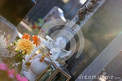 Marmoreal white Angel at the cemetery, sorrow, sunlight Stock Photo