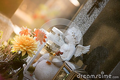 Marmoreal white Angel at the cemetery, sorrow, sunlight Stock Photo