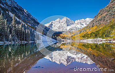 Maroon Bells in fall foliage after snow storm in Aspen, Colorado Stock Photo