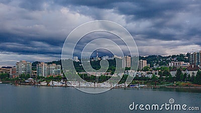 Marquam hill and buildings over Willamette River with boats in Portland, USA Stock Photo