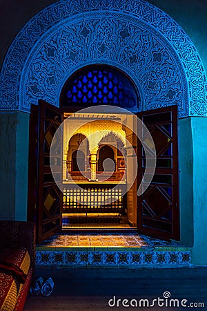 MARRAKESH, MOROCCO - JAN 2019: Moroccan architecture traditional arabian design - Rich Riyad arch mosaic interior Editorial Stock Photo