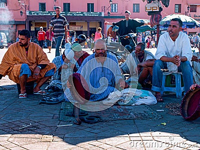 Marrakesh, Morocco - Charmers in el-fnaa square Editorial Stock Photo