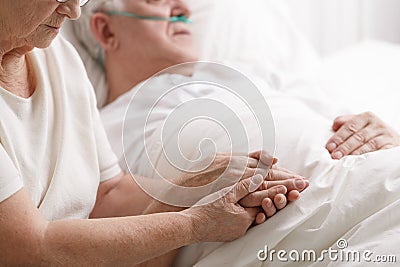 Marriage holding hand`s in hospital Stock Photo