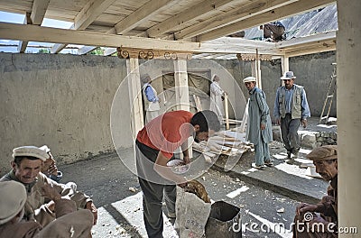 Before the marriage of two young people, the whole village participates with labor, tools of labor, raw materials, good will so th Editorial Stock Photo