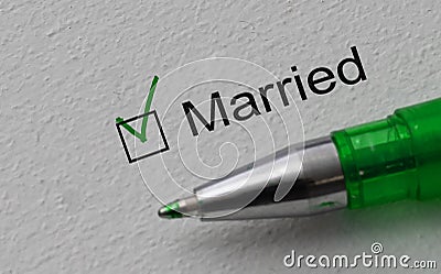 Married - checkbox with a cross on white paper with pen. Checklist concept. Stock Photo