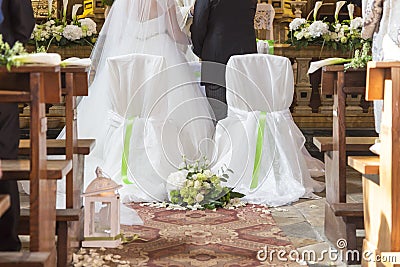 Married couple in front of the church altar Stock Photo