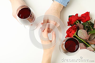 Married couple hands, wine and roses on white background Stock Photo