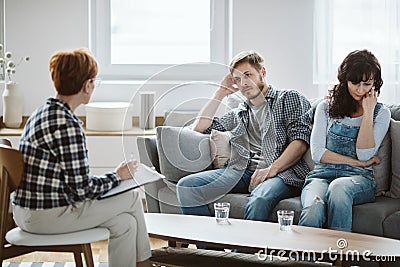 Young married couple during telegraphy while considering divorce Stock Photo