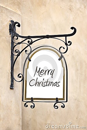 Marry Christmas on a wrought iron old sign Stock Photo