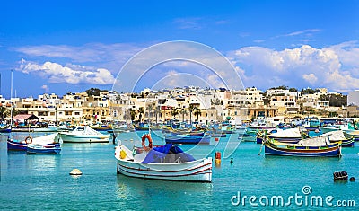 Marsaxlokk village with traditional colorful fishing boats Luzzu Stock Photo