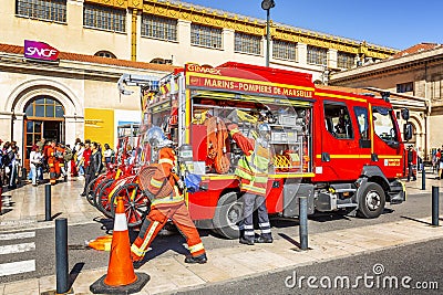 Marseille, France, 08/10/2019: Firefighters at the city`s railway station. Evacuated passengers are waiting on the street Editorial Stock Photo