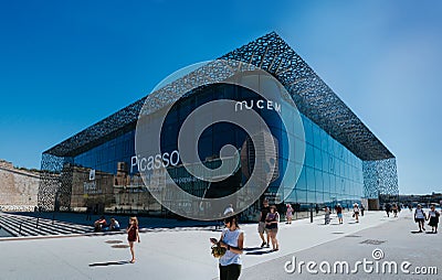 MARSEILLES, FRANCE - JUNE 22, 2016: Tourists and local people walking in front of the modern building of Museum of European and Editorial Stock Photo