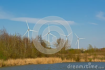 Marshland landscape with windmills behind Editorial Stock Photo