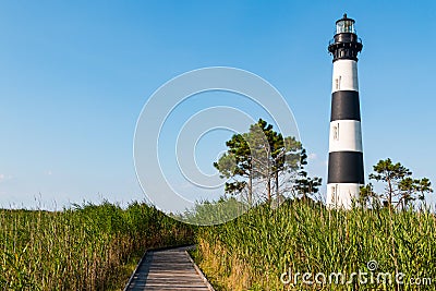 Marshland With Wooden Boardwalk to Bodie Island Lighthouse Stock Photo