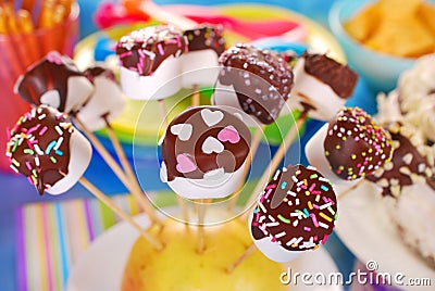 Marshmallow pops with chocolate and colorful sprinkles Stock Photo