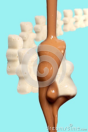 Marshmallow teddybears lining up to be covered in milk chocolate Stock Photo