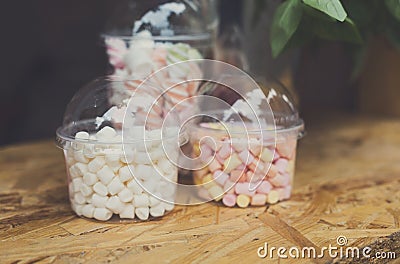 Marshmallows in glass jars on bar for sale Stock Photo