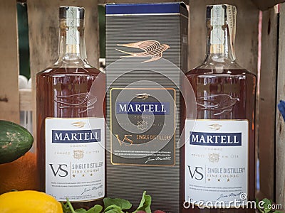 Martell logos on Cognac bottles on display. Martell is a French brand of cognac and spirits, part of Pernod Ricard Editorial Stock Photo