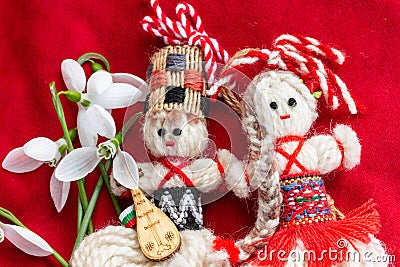Martenitsa - traditional Bulgarian custom - red background with snowdrops Stock Photo