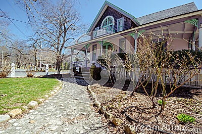 MARTHA `S VINEYARD, MA - Pink Carpenter Gothic Cottages with Victorian style, gingerbread trim in the village of Oa Editorial Stock Photo