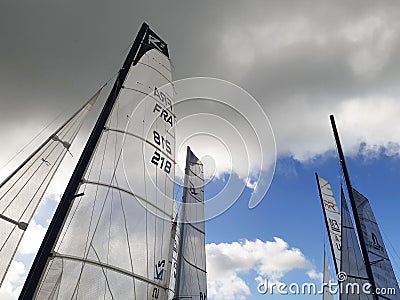 Catamaran sails under tropical blue skies of the French Antilles. Head sails of regatta sailboats Editorial Stock Photo