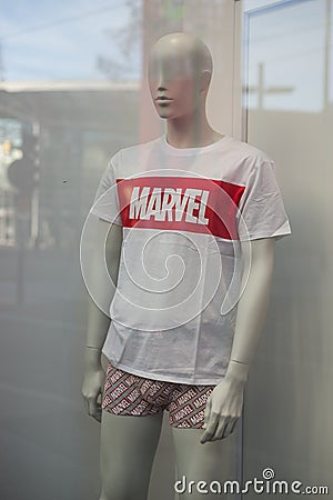 Marvel logo on white teeshirt in a fashion store showroom Editorial Stock Photo