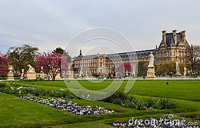 Marvelous spring Tuileries garden and view at the Louvre Palace in Paris France. April 2019 Editorial Stock Photo