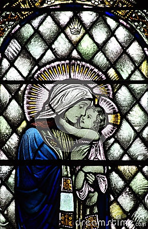 Mary comforting baby Jesus (stained glass) Stock Photo