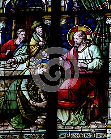 Mary Magdalene washing the feet of Jesus (stained glass) Stock Photo