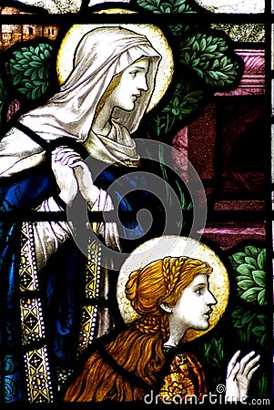 Mary and Mary Magdalene in a stained glass window Stock Photo