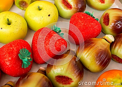 Marzipan assortment. Sweet marzipan with colorful fruit shapes. Marzipan is a typical Sicilian sweet. Italian food Stock Photo