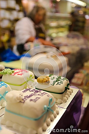 Marzipan Covered Decorated cakes in display Stock Photo