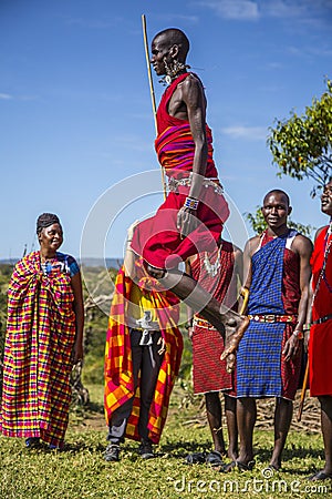 MASAI MARA, KENYA - Aug 15, 2018: A Masai local jumping Editorial Stock Photo