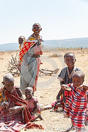 Masai People, Women and Children of Maasai Tribe sitting on ground, Tanzania, Africa Editorial Stock Photo